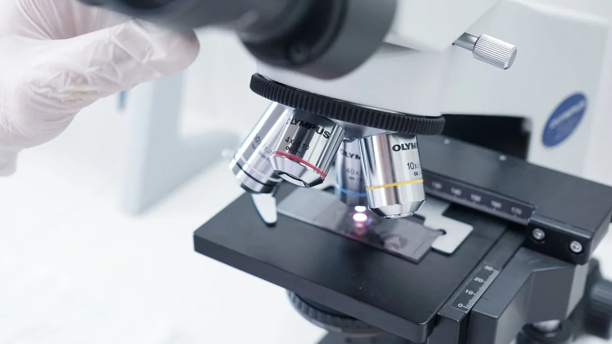 Detailed view of a microscope in a laboratory used in scientific research.