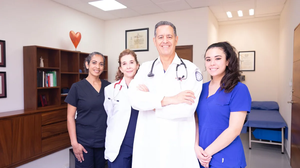 Group of diverse healthcare professionals in a clinical setting.