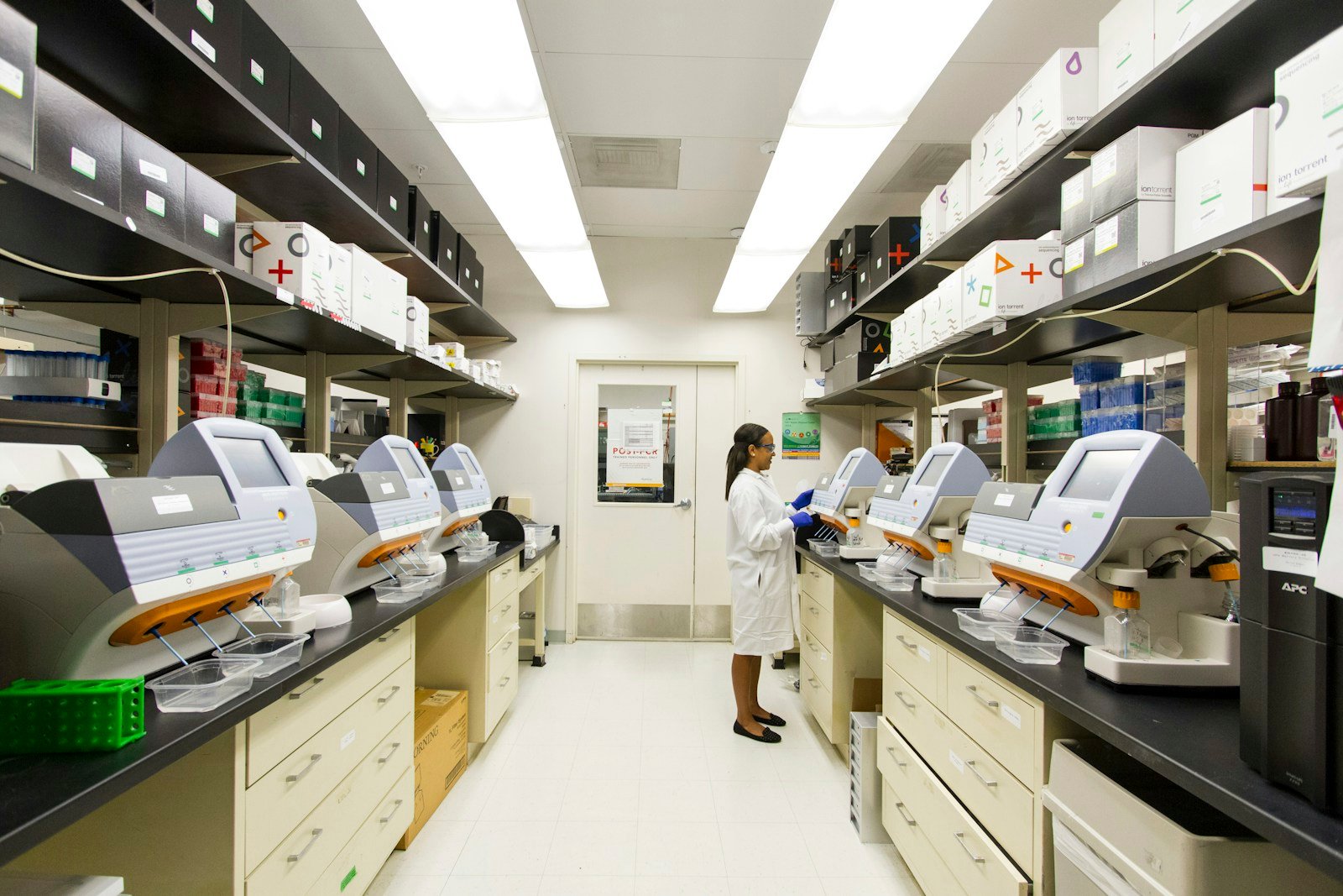 Laboratory specimen vials under controlled lighting