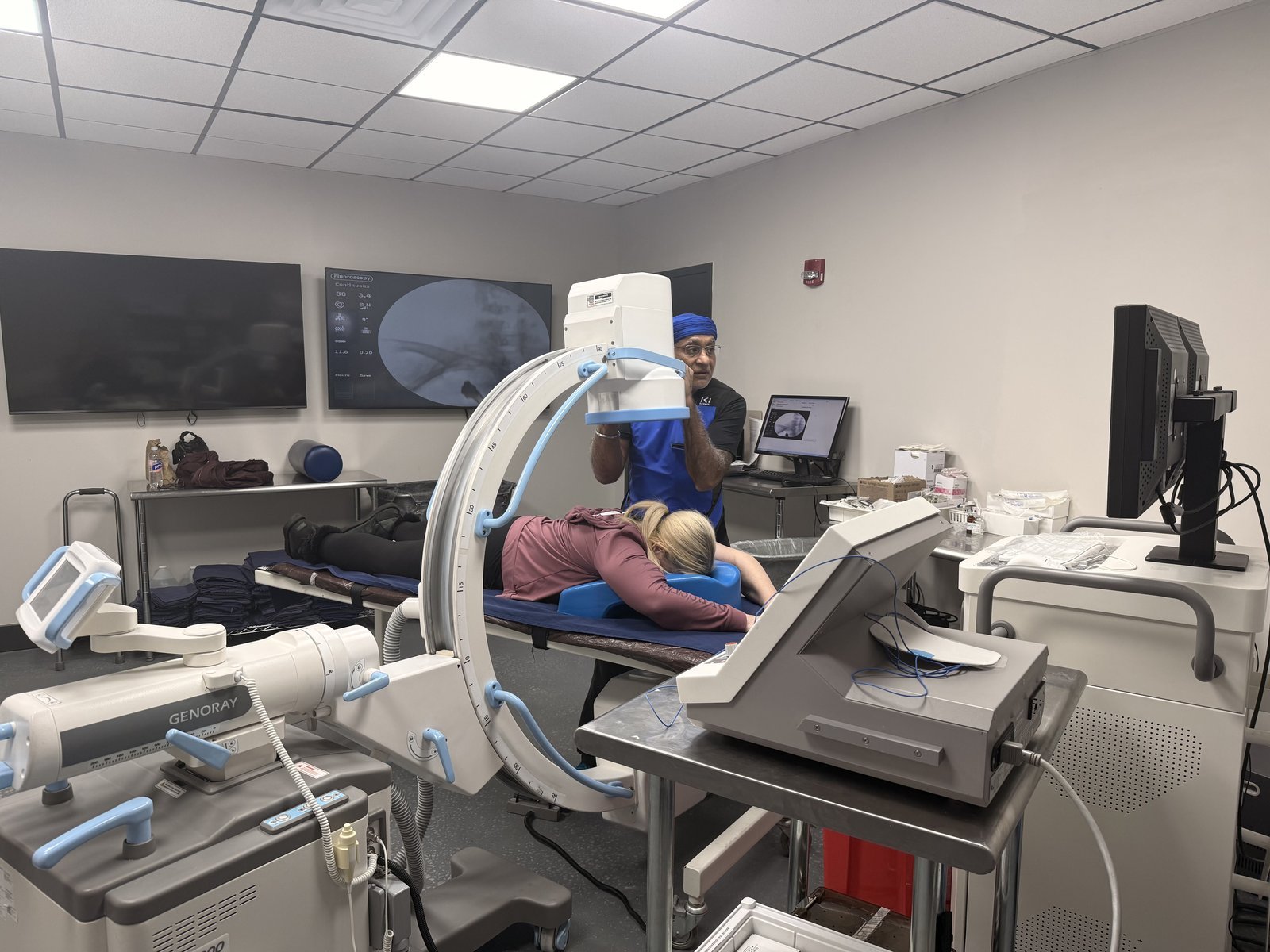 Image-guided procedure in progress in the C-arm fluoroscopy suite at Regen.MD, 4477 Woodson Rd, St. Louis