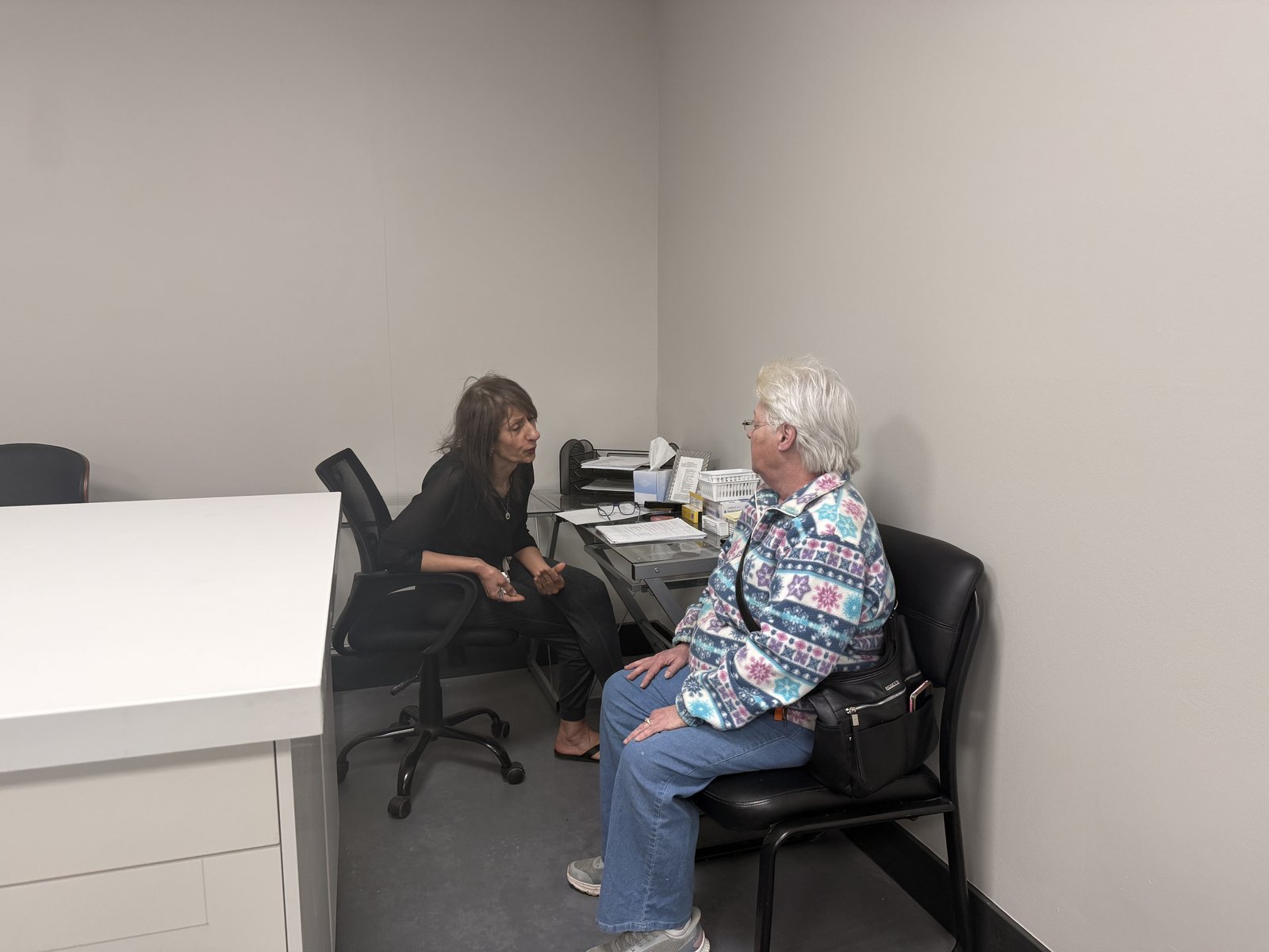 Clinical team member reviewing a case one-on-one with a patient at Regen.MD, St. Louis